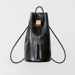 Leather Convertible Bucket Bag Backpack with Tassel Closure and Wooden Detail